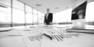 Cash management - Man in boardroom with data charts