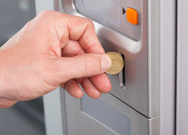 Coin_vending-machine Coin being inserted into a vending machine.