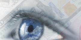 Counterfeit banknotes being visually checked.