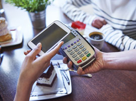 Mobile-Cashless Payments Image of a smartphone being used to make a mobile cashless contactless payment.