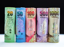 Image of rolls of Thailand banknotes